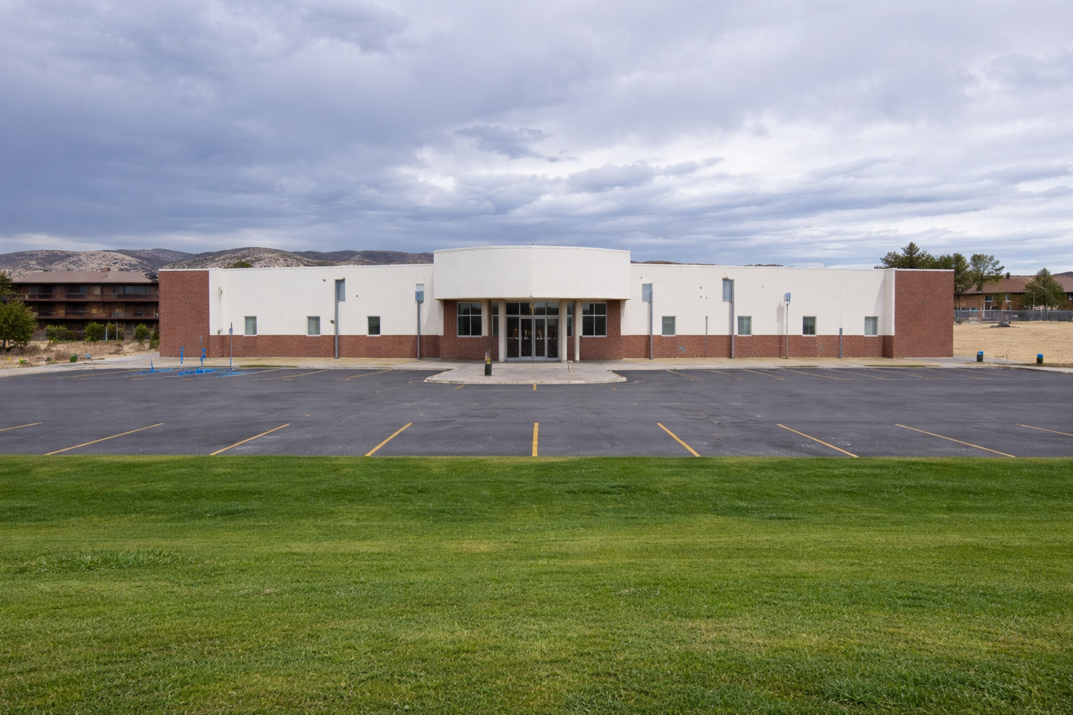 Commercial building exterior with central entry